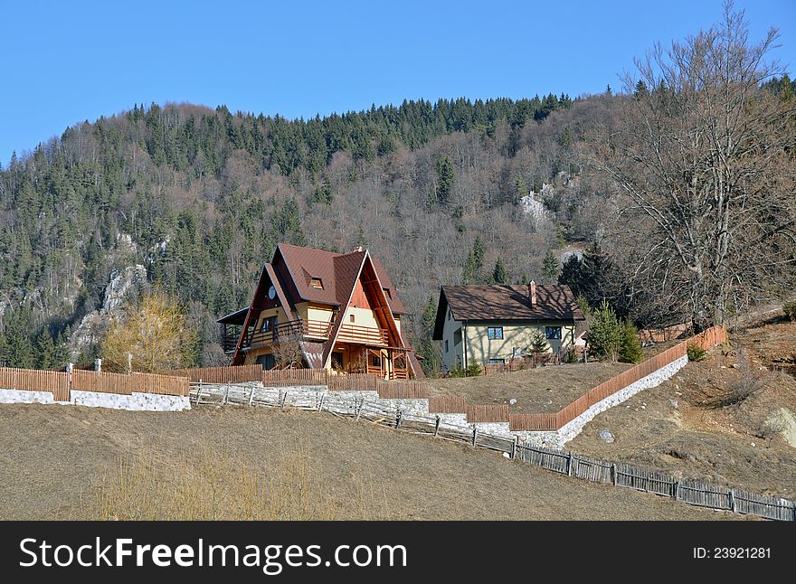 Wooden cottage in sunny winter day near pine forest. Wooden cottage in sunny winter day near pine forest