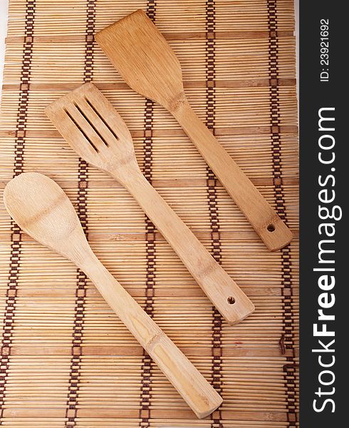 Wooden kitchen set  laying on wooden cover