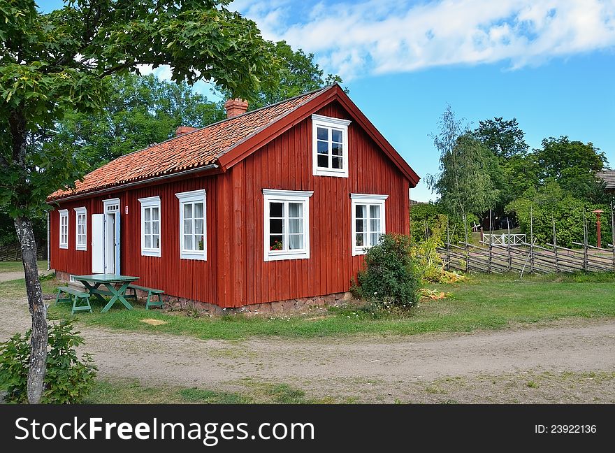 Typical scandinavian red wooden house in village. Typical scandinavian red wooden house in village