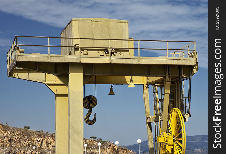 Yellow crane against blue sky