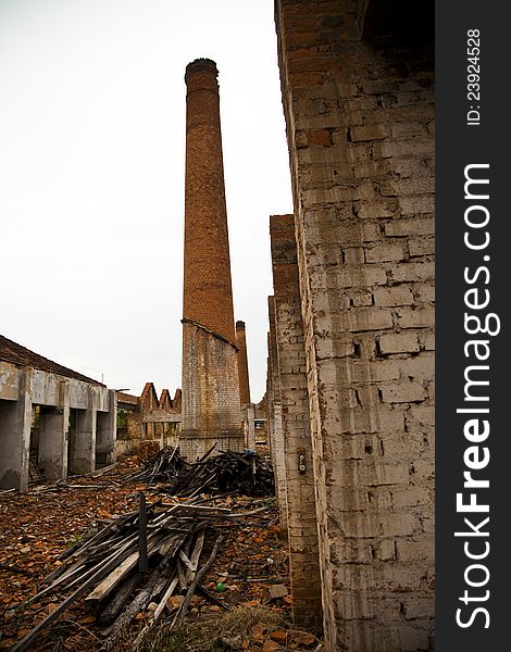 Ruins of a old plant / factory with industrial brick chimney