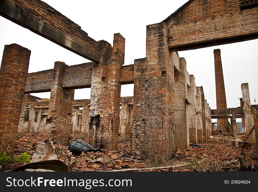 Ruins of a old plant / factory with industrial brick chimney