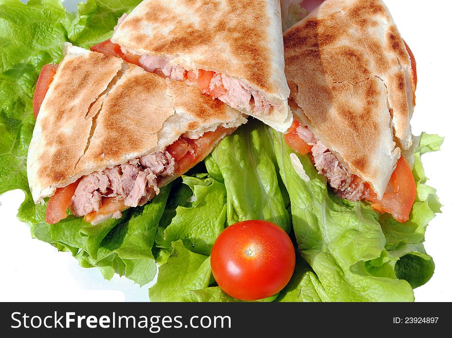 Tortilla with tuna and tomatoes, typical italian flatbread