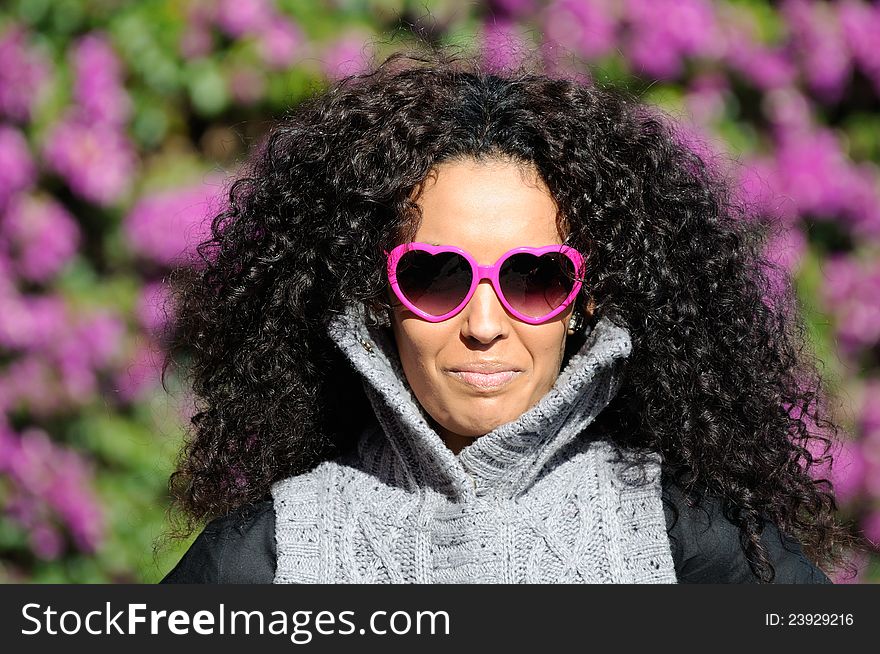 Portrait of a Funny black girl with purple heart glasses