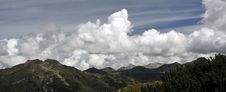 Mountain Peaks And Clouded Sky Panorama Royalty Free Stock Photo