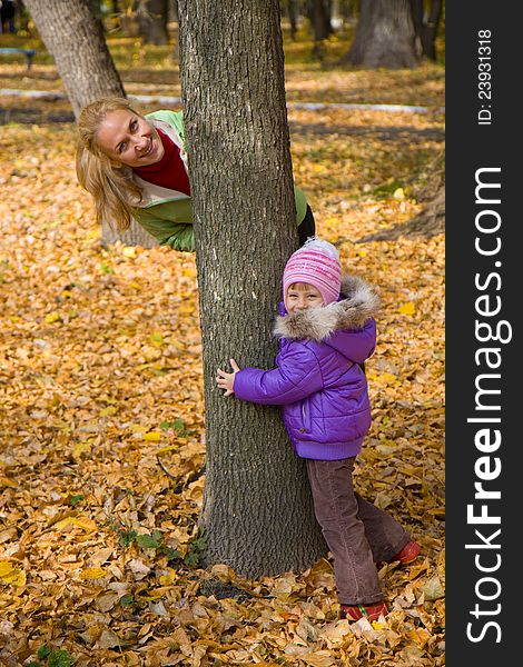 Woman  With Her Daughter In The Autumn Park