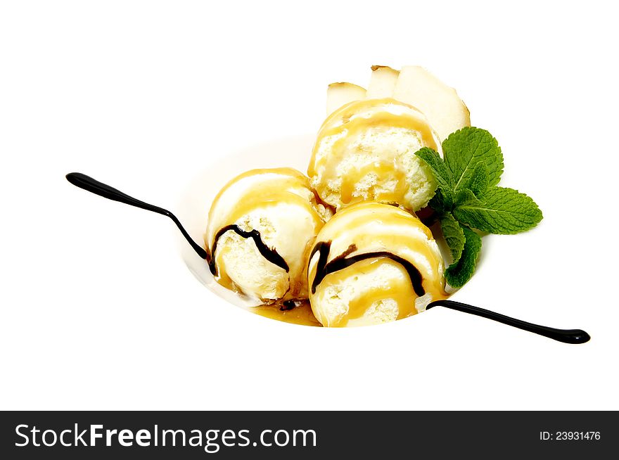 Ice cream balls with chocolate cream on a white background