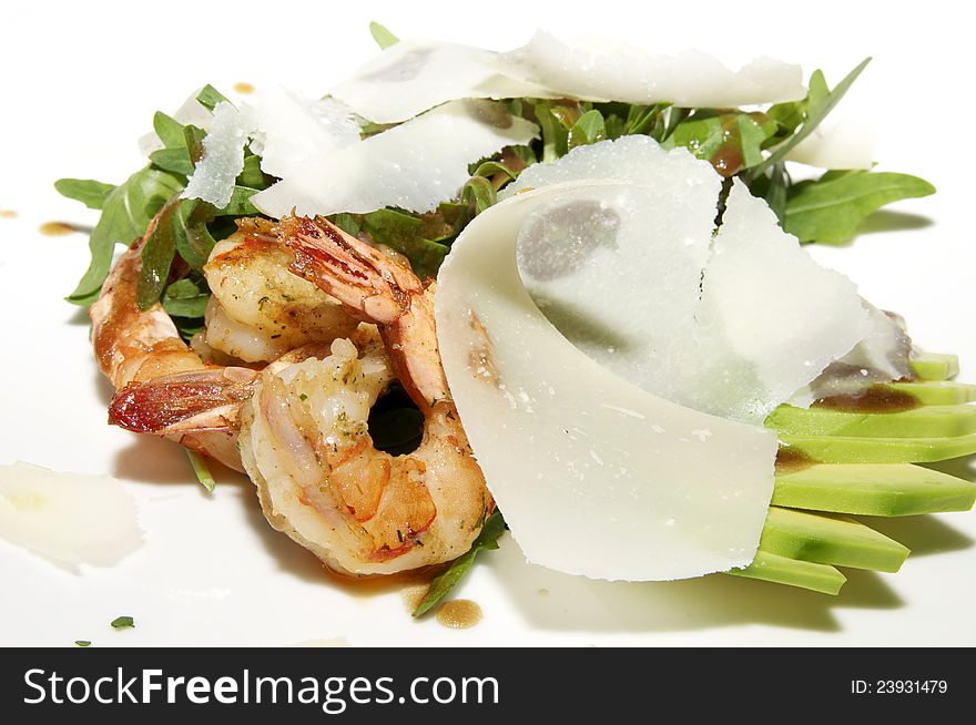 Salad greens with shrimp and cheese on white plate. Salad greens with shrimp and cheese on white plate