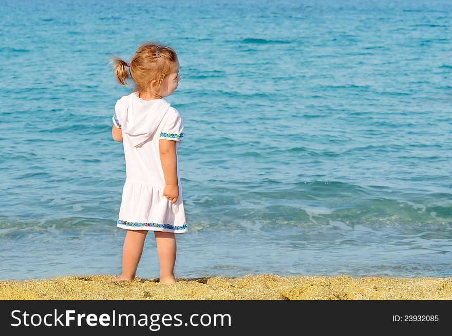 Happy child on the beach, summer vacation concept