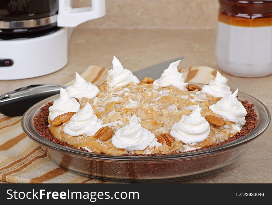 Whole peanut butter pie on kitchen counter