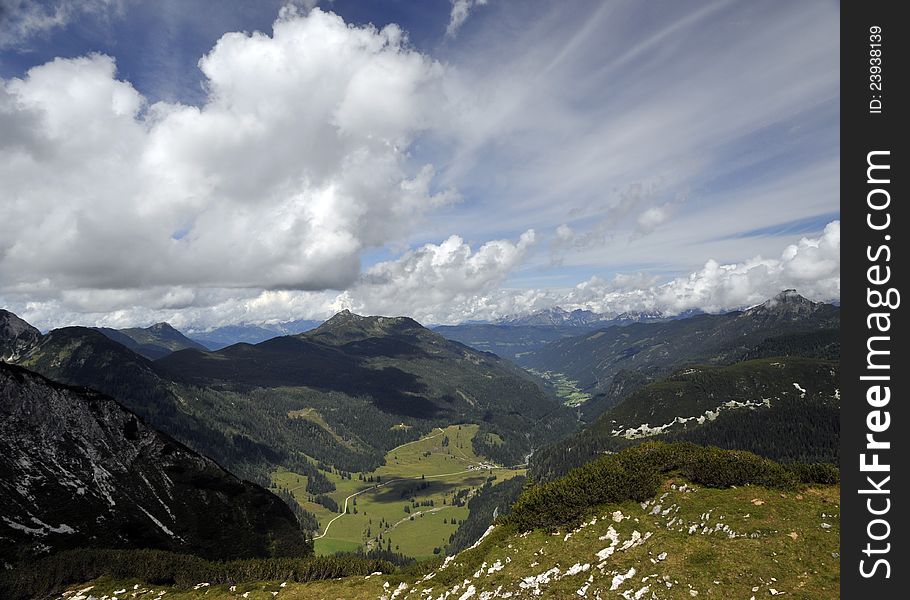 Alpine landscape: mountain peaks and beautiful cloudy sky in Obertauern area, Austrian Alps, Europe. Alpine landscape: mountain peaks and beautiful cloudy sky in Obertauern area, Austrian Alps, Europe