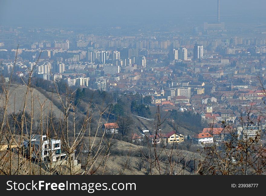 Aerial Brasov view from Poiana Brasov mountain. Brasov is one of the largest city in Romania, with great winter touristic attractions. Aerial Brasov view from Poiana Brasov mountain. Brasov is one of the largest city in Romania, with great winter touristic attractions.