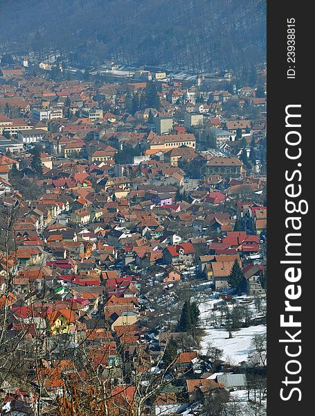 Aerial Brasov view from Poiana Brasov mountain. Brasov is one of the largest city in Romania, with great winter touristic attractions. Aerial Brasov view from Poiana Brasov mountain. Brasov is one of the largest city in Romania, with great winter touristic attractions.