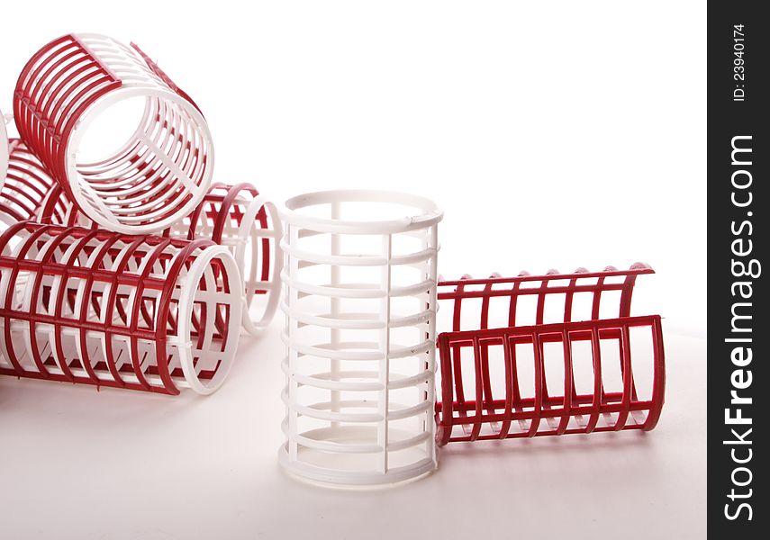 Red and white hair roller on the table