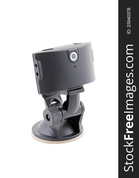Car video recorder in black on the suction cup to the glass. Car video recorder in black on the suction cup to the glass