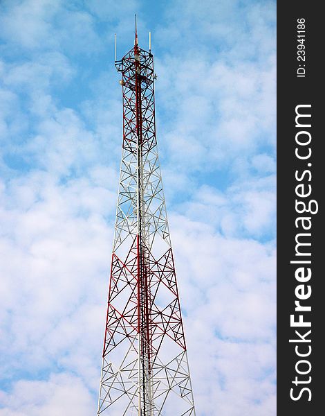 Very high antenna pole tower and blue sky