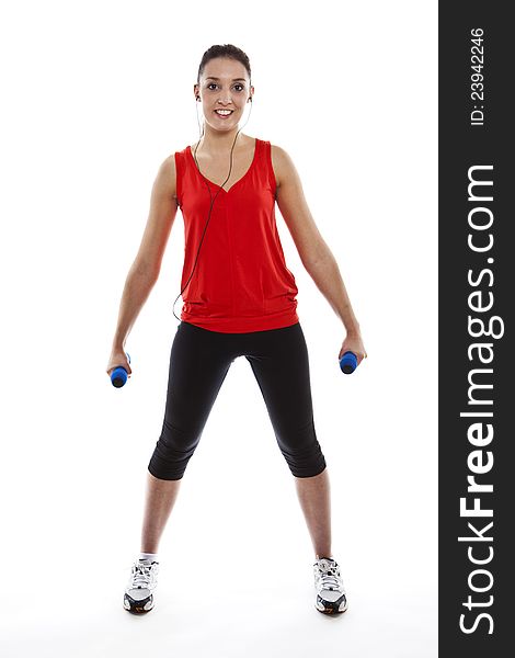 Young fit woman exercising with weights