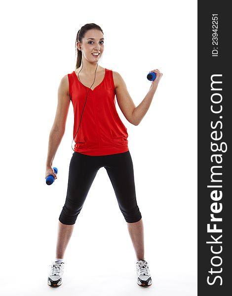 Young fit woman exercising with weights