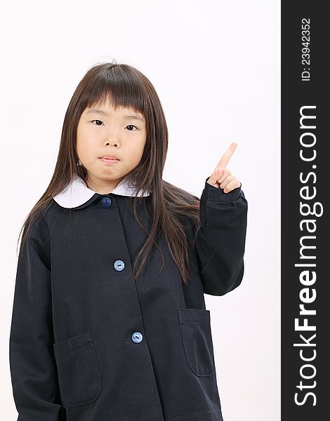 Little asian schoolgirl rise hand and pointing