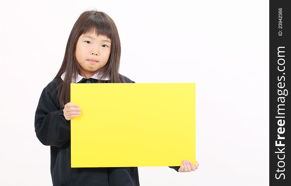 Little asian schoolgirl holding a blank board