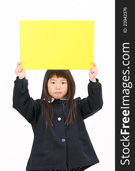 Little asian schoolgirl holding a blank board