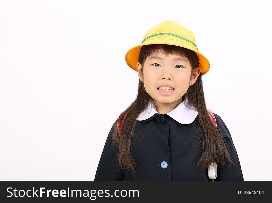 Little asian schoolgirl in school uniform