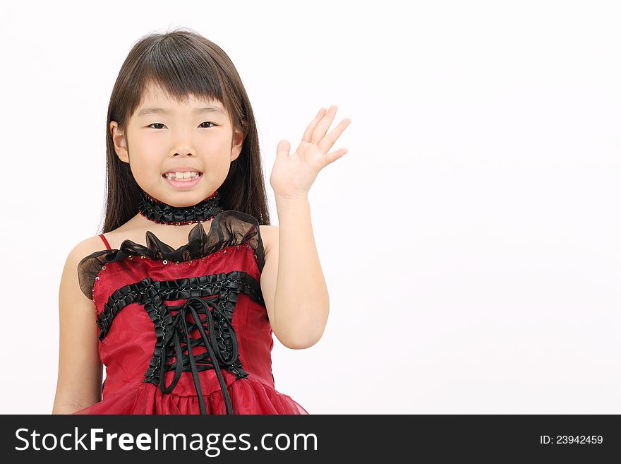 Little asian girl wearing dress, showing blank sign