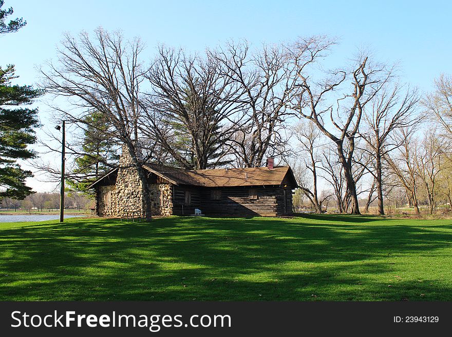 Spring field landscape and wooden house. Spring field landscape and wooden house