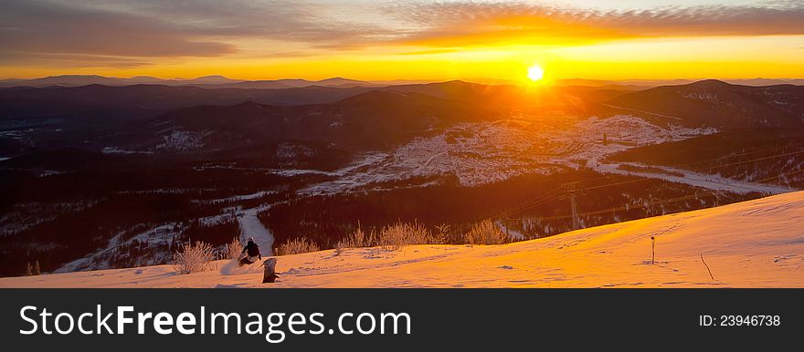 Winter sunset in the forest in Siberia