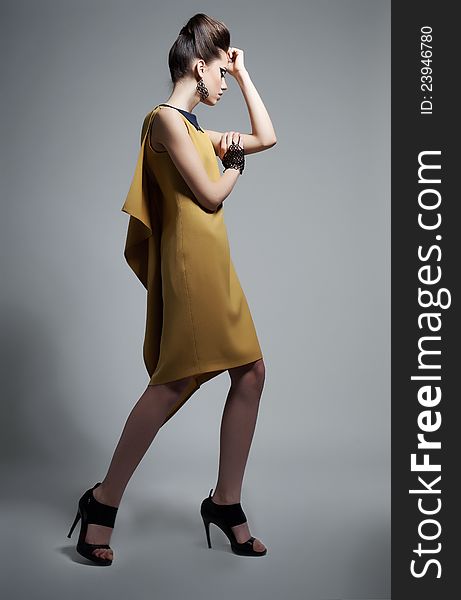 Fashionable Emotional Woman In Modern Yellow Dress