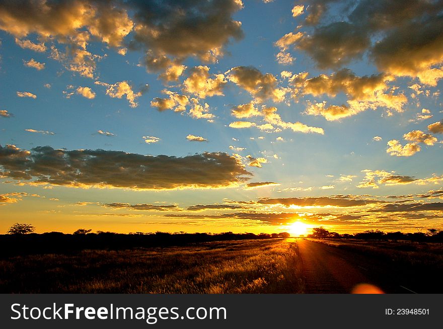 Sunset over the road at Omitara, Namibia. Sunset over the road at Omitara, Namibia