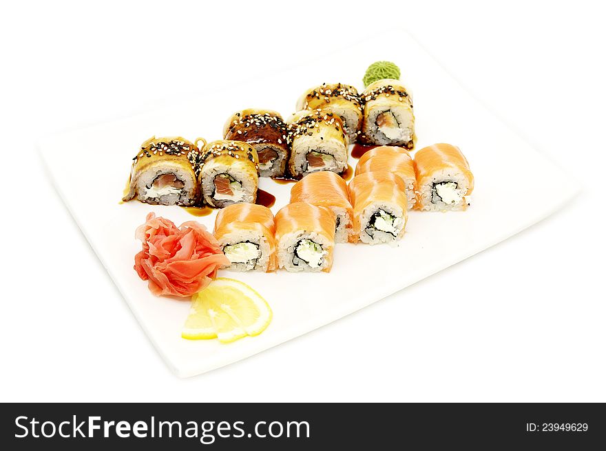 Sushi with rice and fish on a white plate