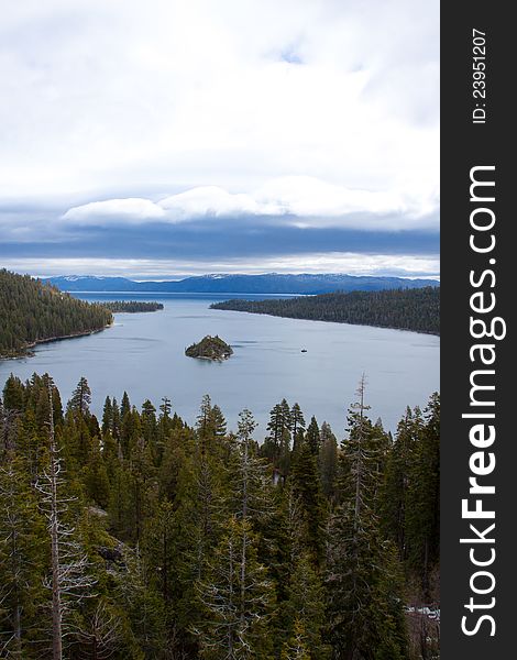 Views of Lake Tahoe in California with crystal clear water, snow on the ground, and mountains in the background. Views of Lake Tahoe in California with crystal clear water, snow on the ground, and mountains in the background.