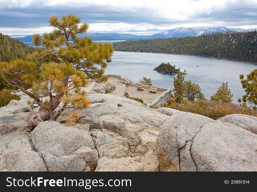 Views of Lake Tahoe in California with crystal clear water, snow on the ground, and mountains in the background. Views of Lake Tahoe in California with crystal clear water, snow on the ground, and mountains in the background.