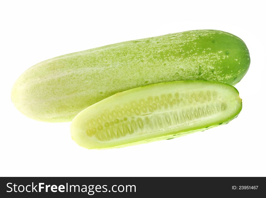 Closeup photo of fresh cucumber cut in half, isola