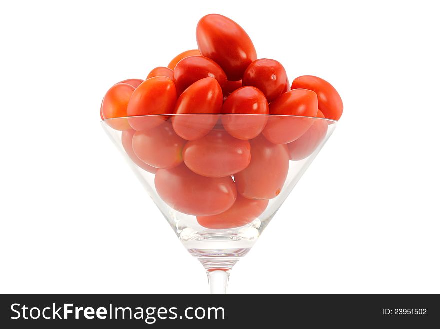 Closeup photo of fresh Cherry Tomatoes (Cocktail tomato) in a cocktail glass, isolated on white background. Closeup photo of fresh Cherry Tomatoes (Cocktail tomato) in a cocktail glass, isolated on white background