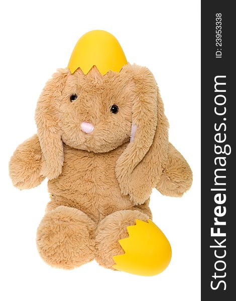Stuffed Toy Bunny Hatching from Yellow Egg, isolated over white background. Stuffed Toy Bunny Hatching from Yellow Egg, isolated over white background.