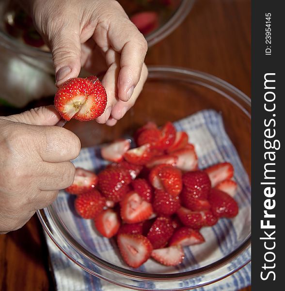 Fresh strawberries sliced into a bowl. Fresh strawberries sliced into a bowl