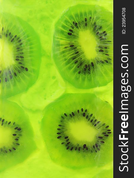 Jelly Kiwi sliced â€‹â€‹on a green background. Jelly Kiwi sliced â€‹â€‹on a green background