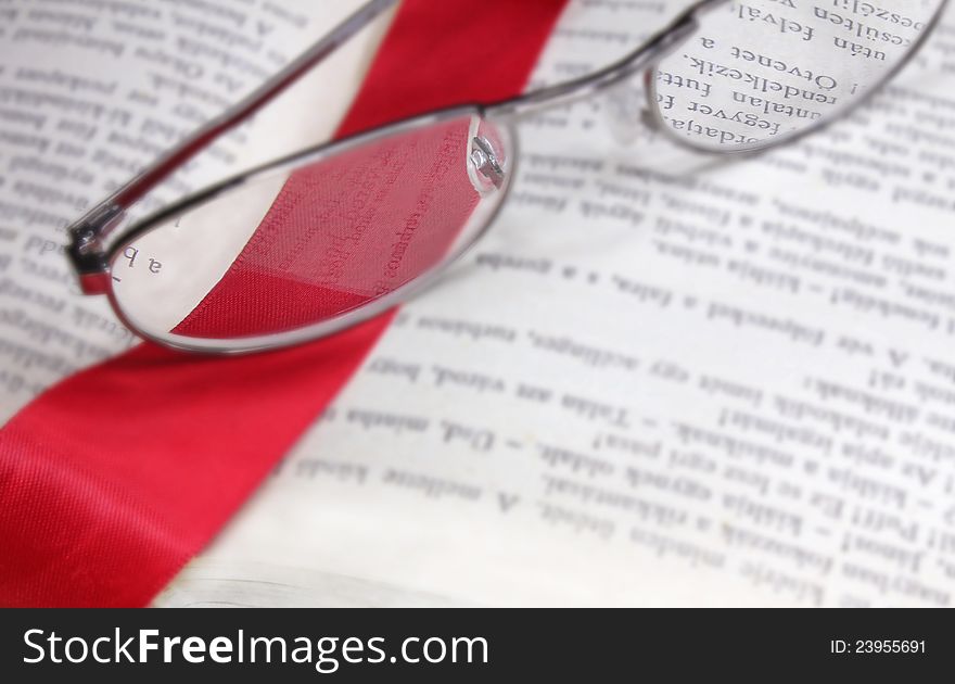 Book Reading Glasses And Red Bookmark