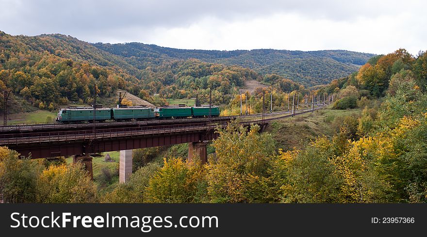 Electric Locomotives On The Bridge In Mountains