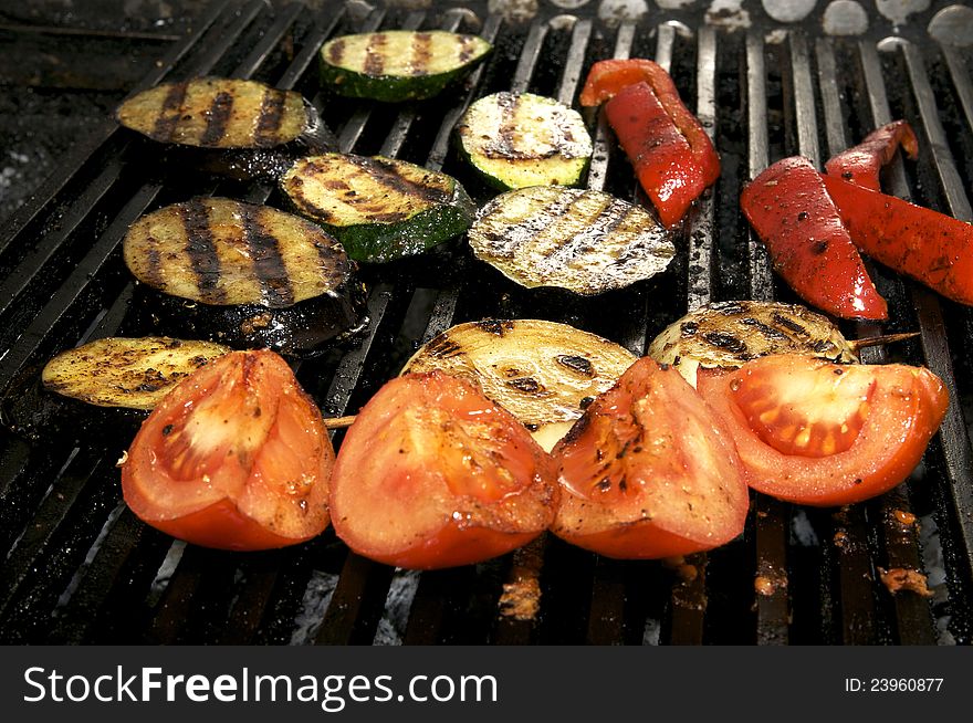 Vegetables on the grill over low heat for preparing