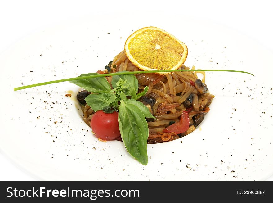 Rice noodles on a plate on a white background