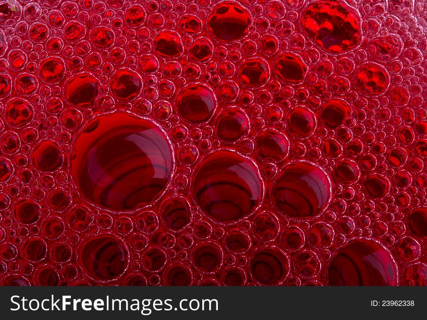 Bubbles of red wine from the different foreshortening  in glass. Bubbles of red wine from the different foreshortening  in glass