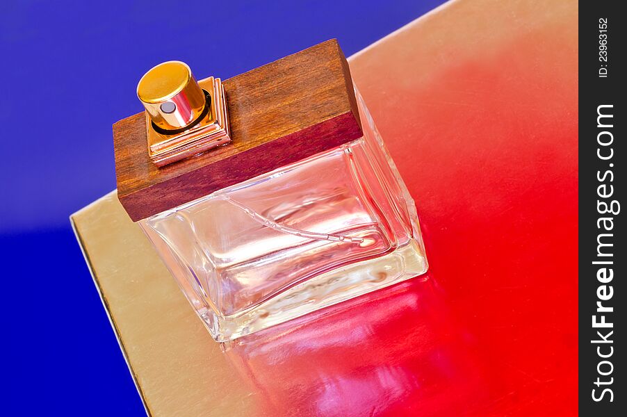 Perfume bottle on a colorful background.