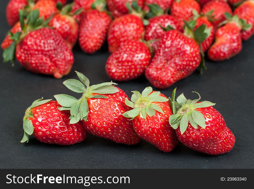 Strawberry- selective focus on the  four front strawberrys