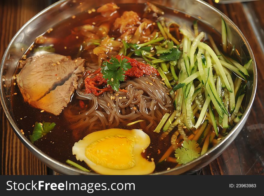 Traditional Korean cuisine dish of cold noodle. Traditional Korean cuisine dish of cold noodle