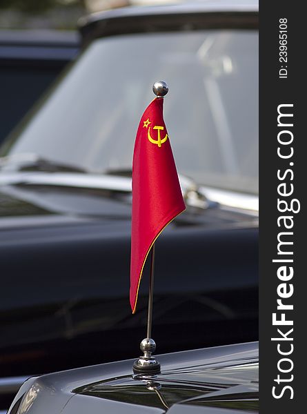 Soviet flag on the car flagpole