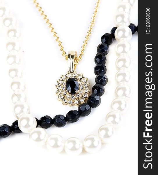 Beads and chain with a pendant on a white background