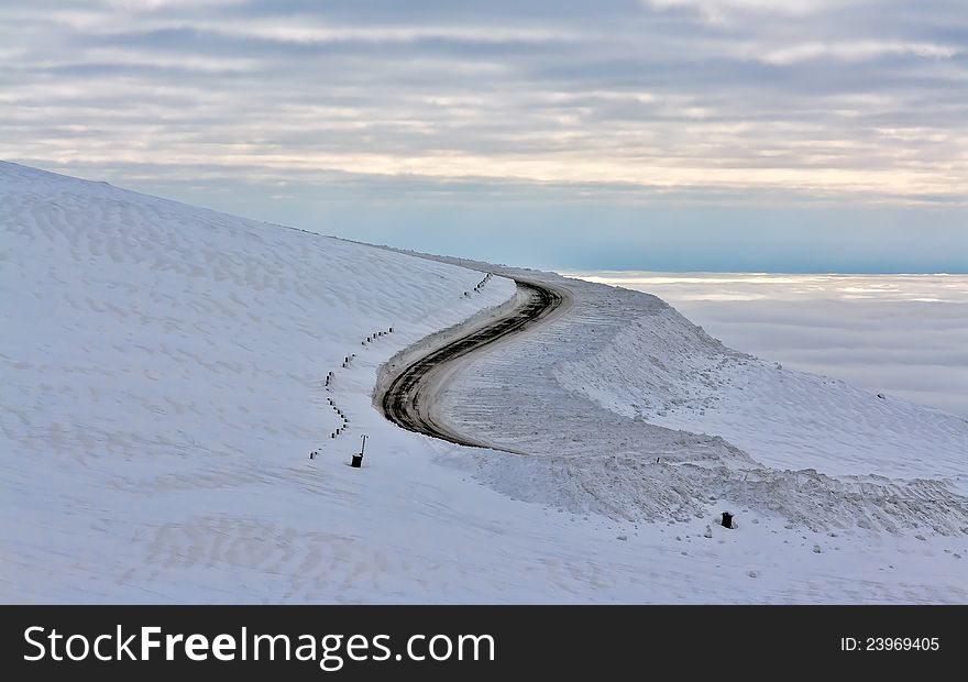 Dirt road in the snowy mountains